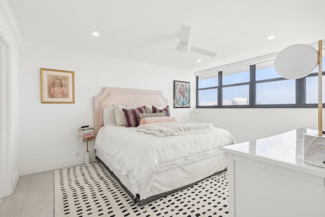 tiled bedroom with ceiling fan and crown molding