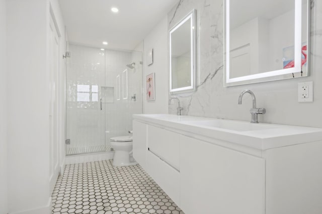 bathroom with vanity, toilet, and walk in shower