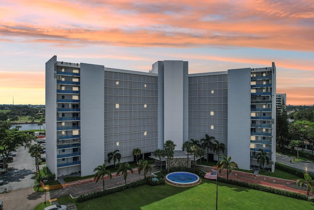 view of outdoor building at dusk