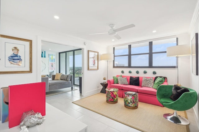 living room featuring ceiling fan and crown molding