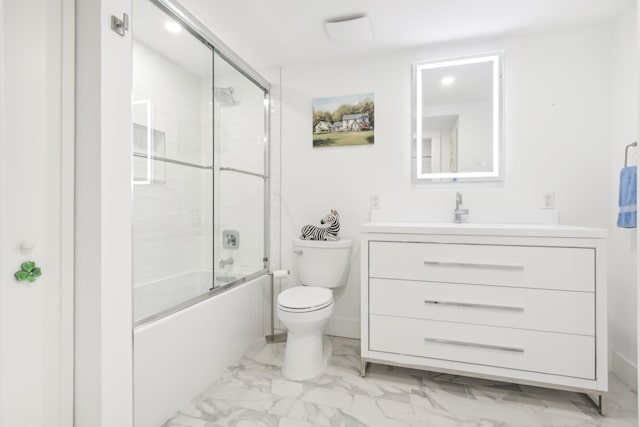 full bathroom with vanity, enclosed tub / shower combo, and toilet