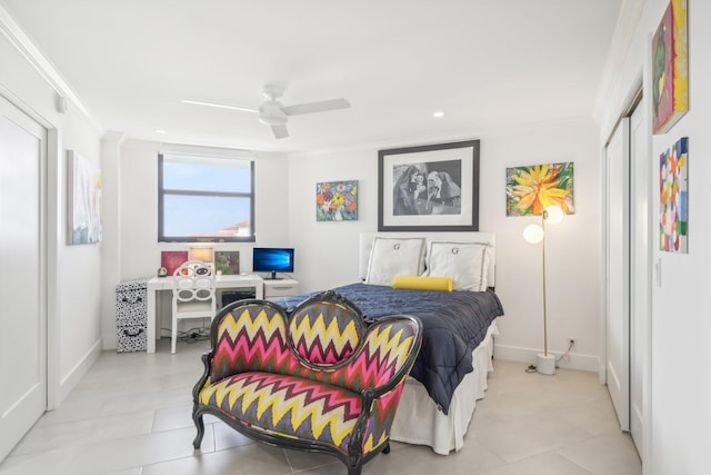 bedroom with a closet, ceiling fan, and crown molding