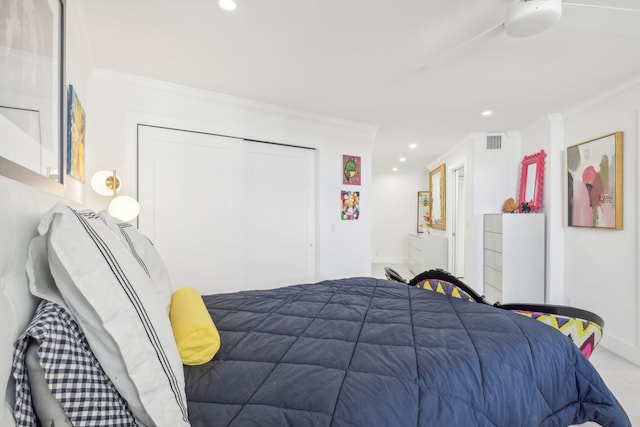 bedroom featuring a closet and ornamental molding