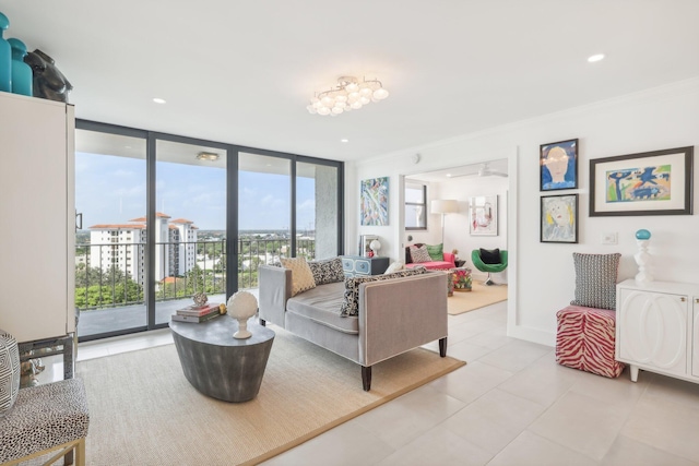 tiled living room featuring expansive windows and ornamental molding