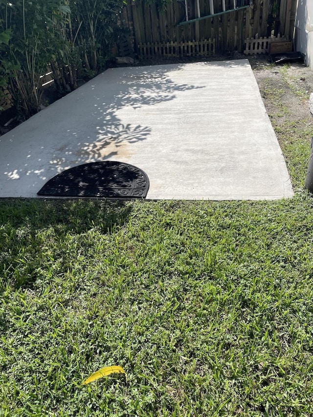 view of patio / terrace featuring fence