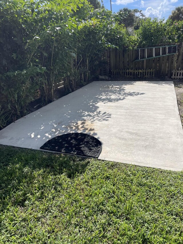 view of patio featuring fence