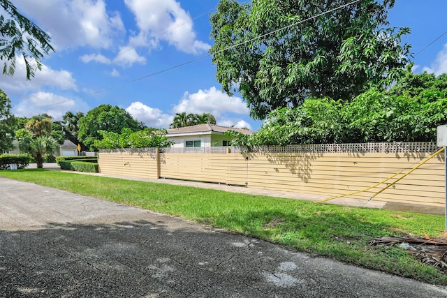 view of home's exterior featuring fence