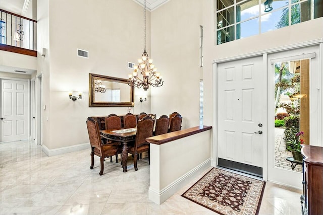 living room with a towering ceiling and ceiling fan