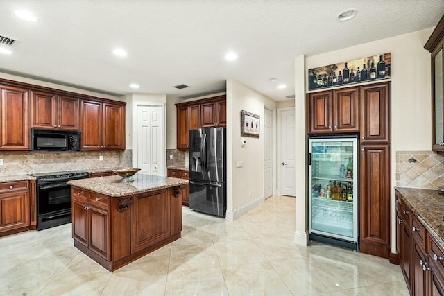 dining room with a high ceiling and a chandelier