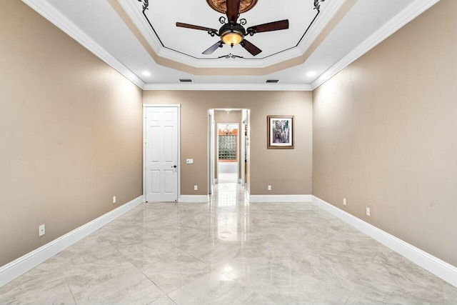 unfurnished room with crown molding, ceiling fan, and a tray ceiling