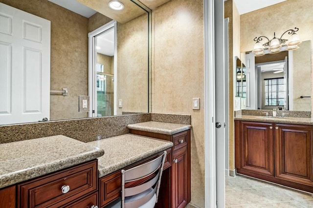 bathroom featuring hardwood / wood-style flooring, vanity, a textured ceiling, and ceiling fan