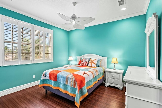 bedroom with crown molding, ceiling fan, and dark hardwood / wood-style flooring