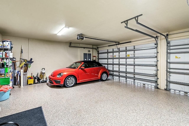 garage featuring a garage door opener