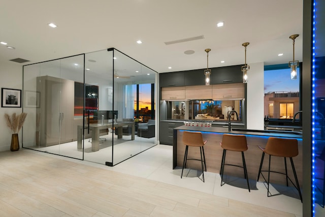 bar featuring light hardwood / wood-style floors and decorative light fixtures