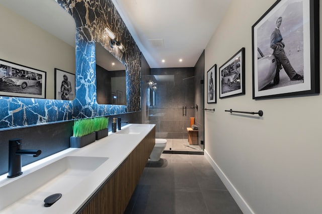 bathroom featuring tile patterned flooring, tiled shower, toilet, and vanity