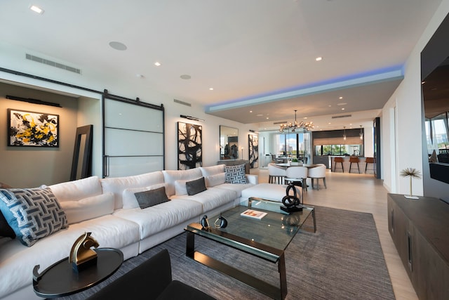 living room featuring a barn door and light hardwood / wood-style floors