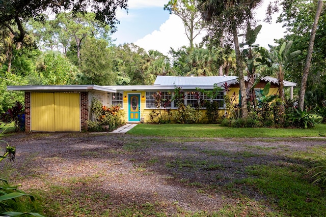 ranch-style home with a front lawn