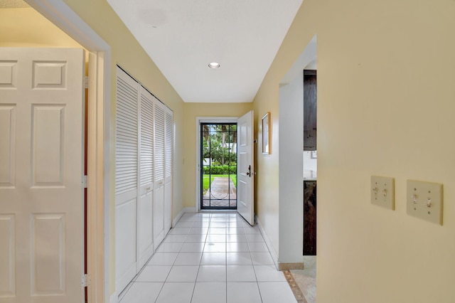 doorway to outside featuring light tile patterned floors