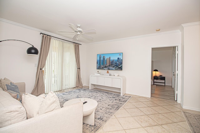 living room with light tile patterned flooring, ornamental molding, and ceiling fan