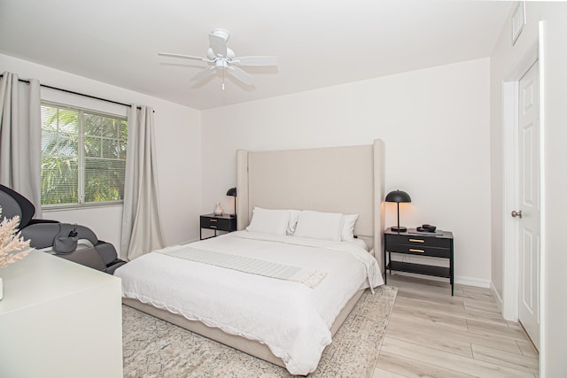 bedroom featuring ceiling fan and light hardwood / wood-style flooring