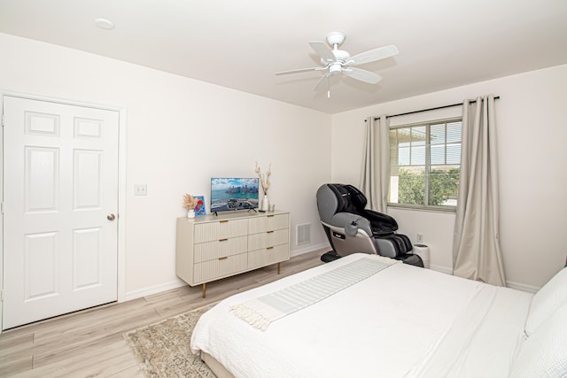 bedroom featuring ceiling fan and light hardwood / wood-style flooring