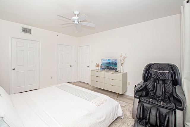 bedroom featuring ceiling fan and light hardwood / wood-style floors