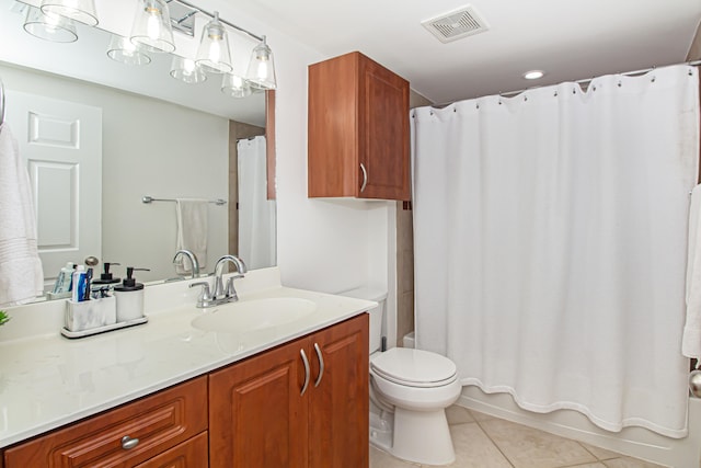 full bathroom featuring vanity, tile patterned flooring, toilet, and shower / tub combo