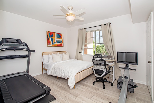 bedroom with light wood-type flooring and ceiling fan