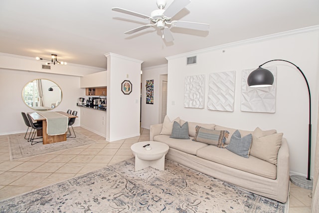 living room featuring crown molding, ceiling fan, and light tile patterned floors