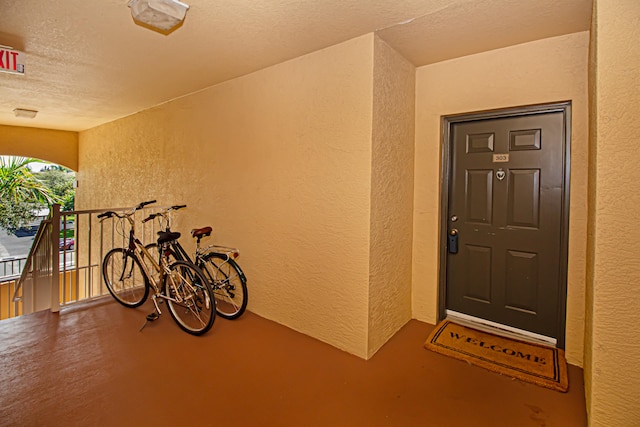 doorway to property featuring a balcony