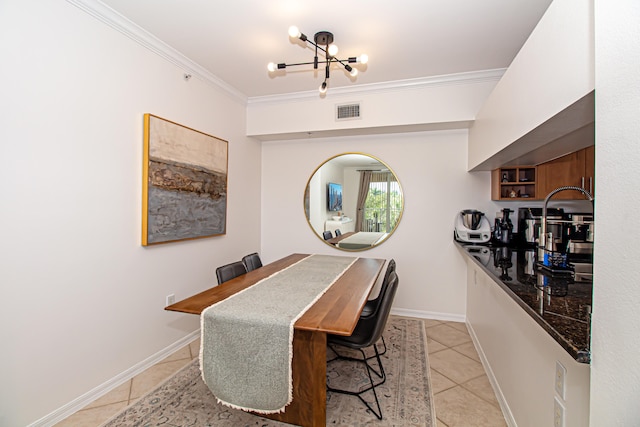 dining area with light tile patterned flooring, crown molding, and a notable chandelier