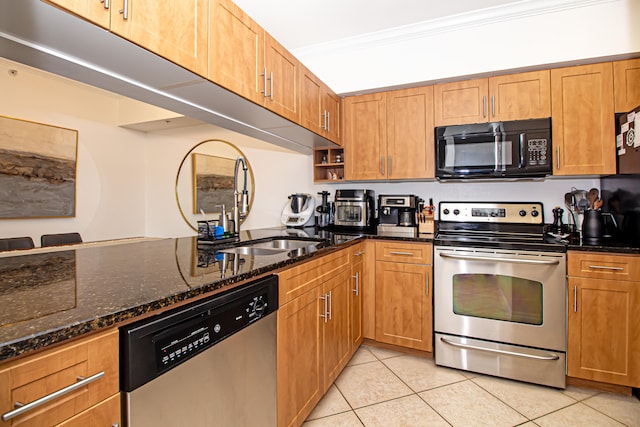 kitchen featuring dark stone countertops, sink, crown molding, appliances with stainless steel finishes, and light tile patterned floors