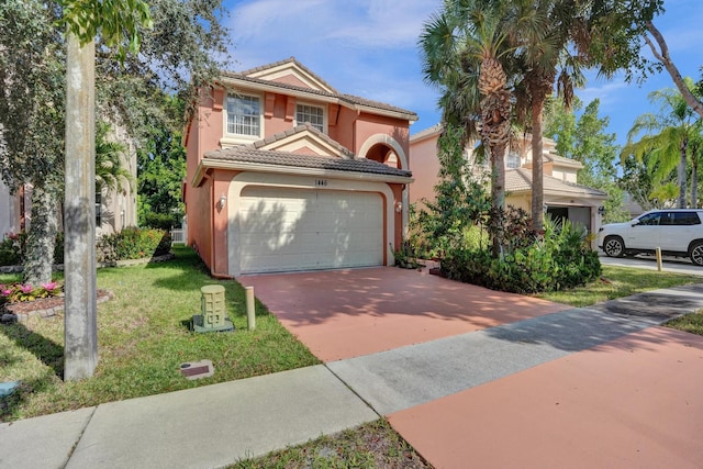 view of front facade featuring a front yard and a garage