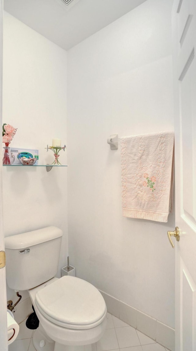 bathroom featuring tile patterned flooring and toilet