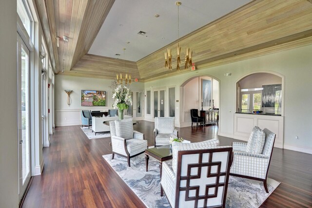 dining area featuring wood ceiling, dark wood-type flooring, and plenty of natural light