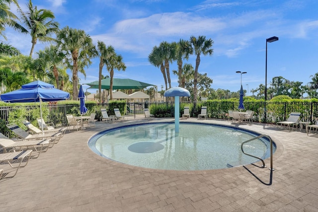 view of swimming pool featuring a patio area