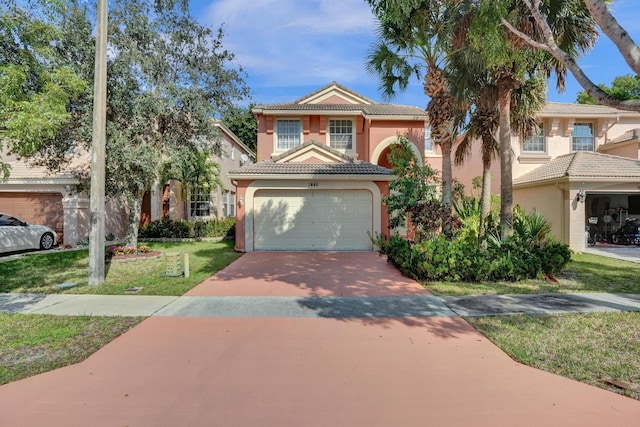 view of front facade featuring a front lawn and a garage