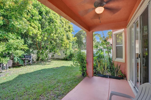 view of yard with a patio and ceiling fan