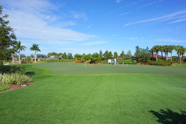 view of property's community with a lawn