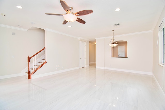 unfurnished room featuring ceiling fan and ornamental molding