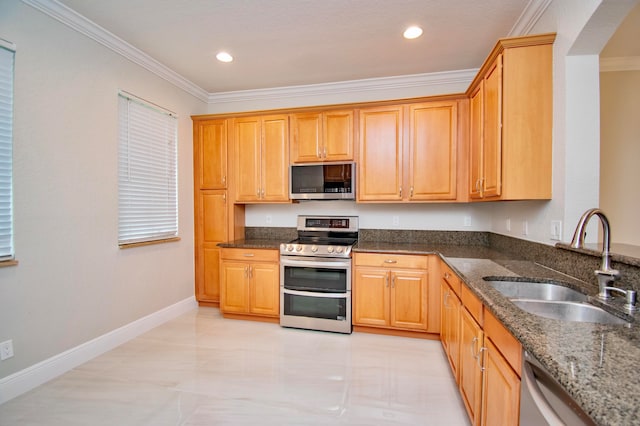 kitchen with light tile patterned floors, ornamental molding, sink, stainless steel appliances, and dark stone counters