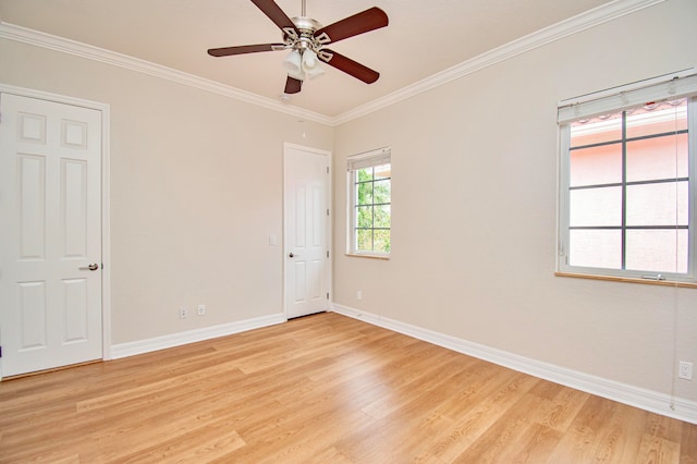 spare room with ornamental molding, light wood-type flooring, and ceiling fan