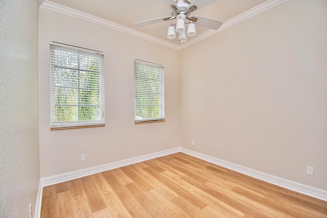 unfurnished room featuring hardwood / wood-style flooring, crown molding, and ceiling fan