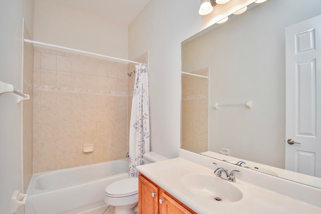 full bathroom with vanity, shower / bath combo with shower curtain, and toilet