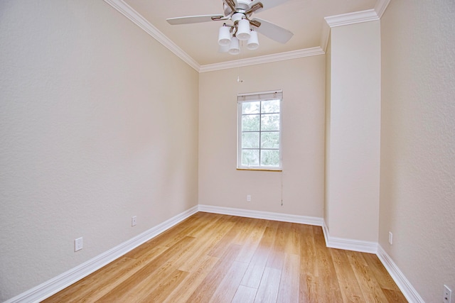 empty room featuring ceiling fan, crown molding, and light hardwood / wood-style floors