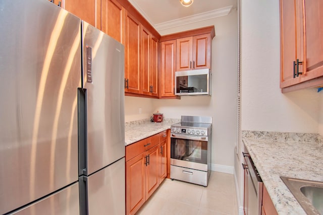 kitchen featuring light stone counters, stainless steel appliances, sink, light tile patterned flooring, and ornamental molding