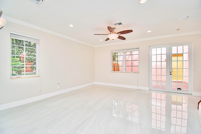 empty room with french doors, ceiling fan, ornamental molding, and a healthy amount of sunlight