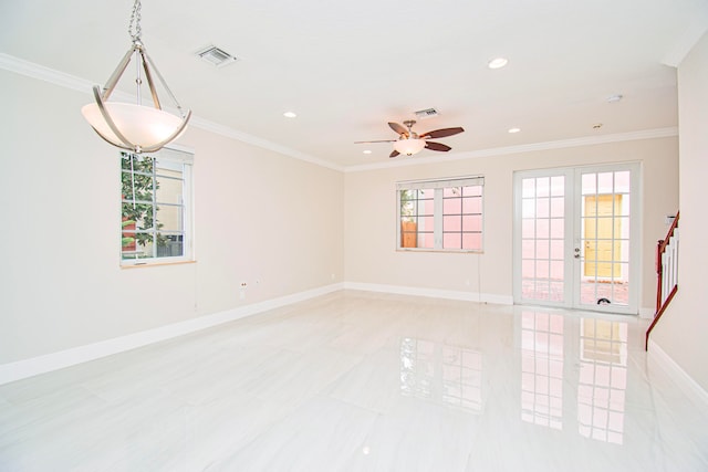 unfurnished room with ceiling fan, a healthy amount of sunlight, and crown molding