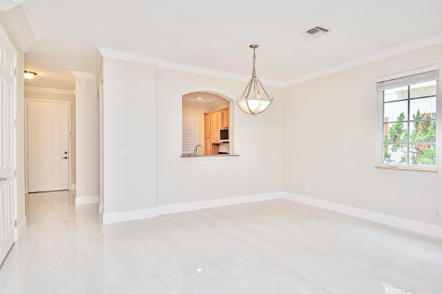 unfurnished room with ornamental molding