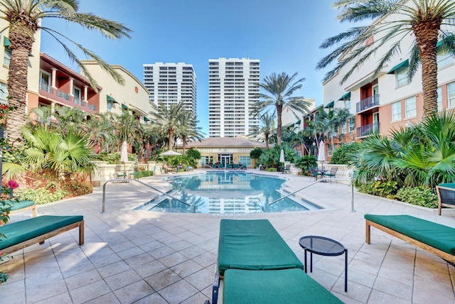 view of swimming pool with a patio